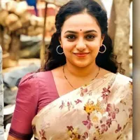Sunita Sharma (Rhea’s Mother)